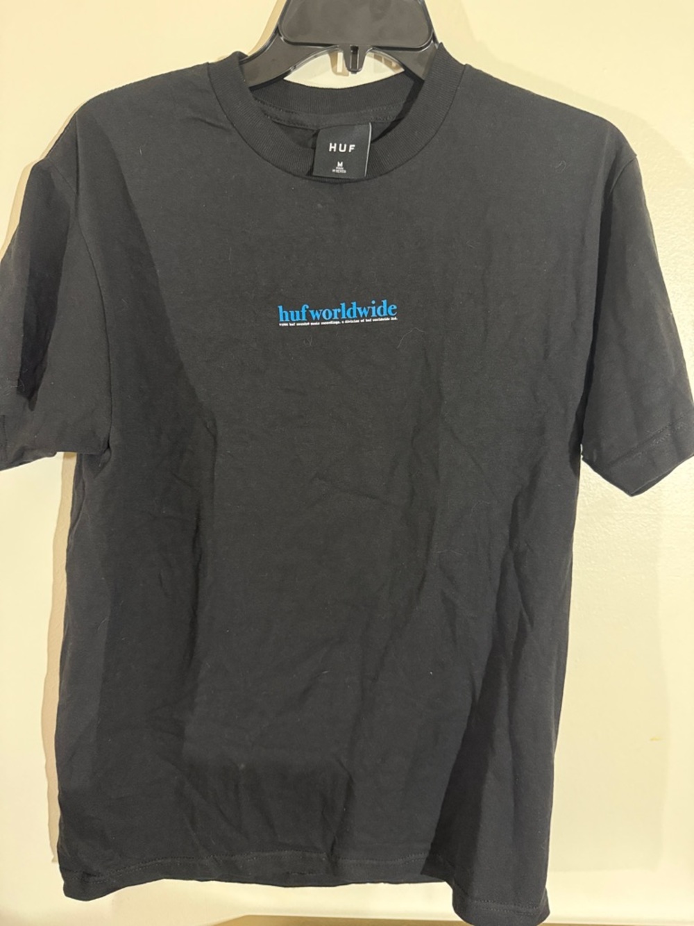HUF Black Short Sleeve Tee with Blue "huf worldwide" Chest Logo